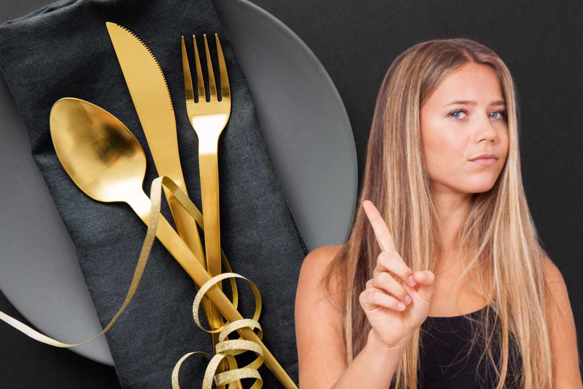 posate nel piatto al ristorante, persona indica no